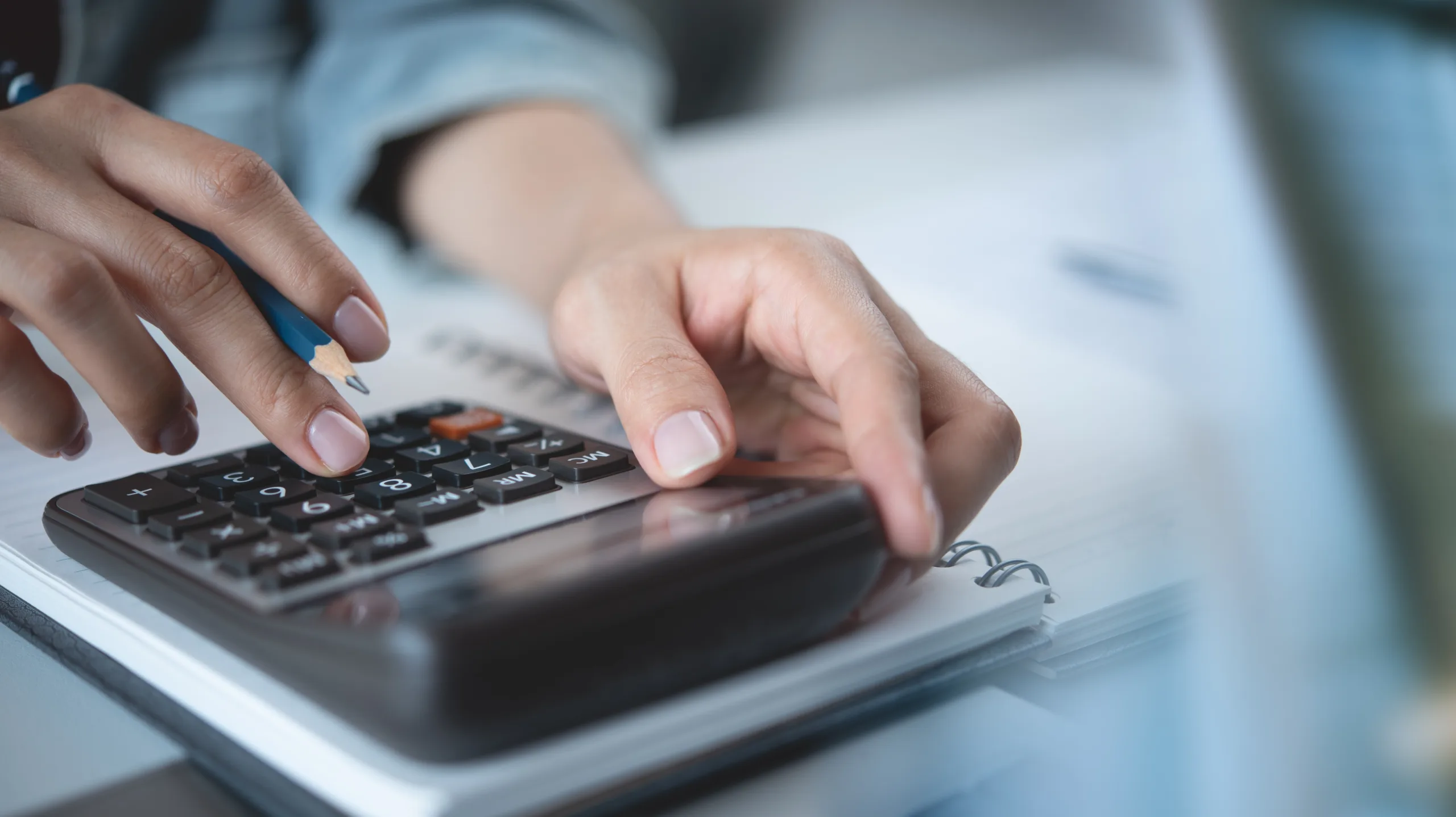 A person using a calculator.