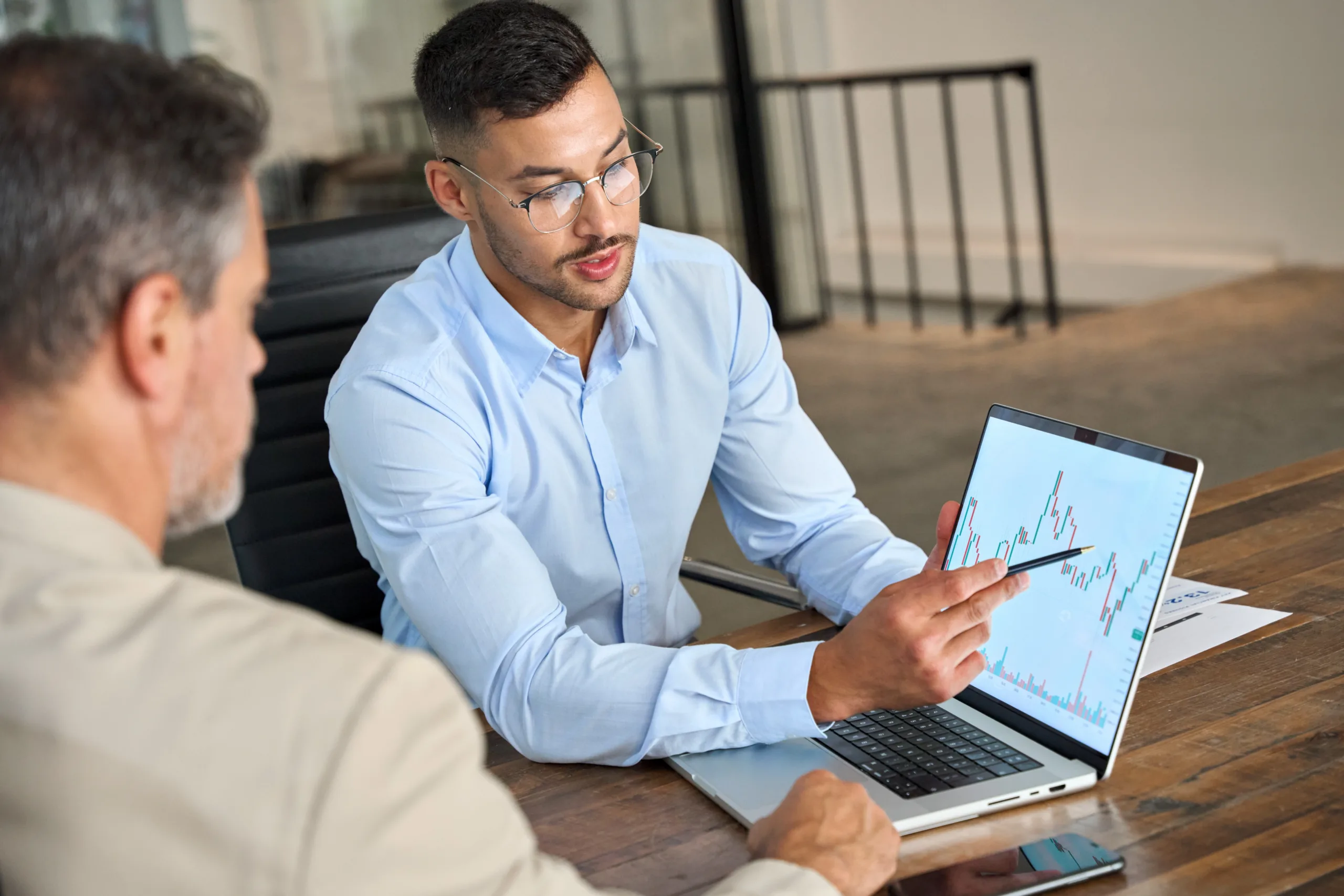 A financial adviser using a graph to explain investment performance.
